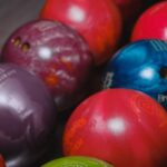 many bowling balls in rack